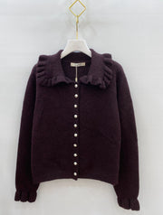 Gilet en maille à col volanté