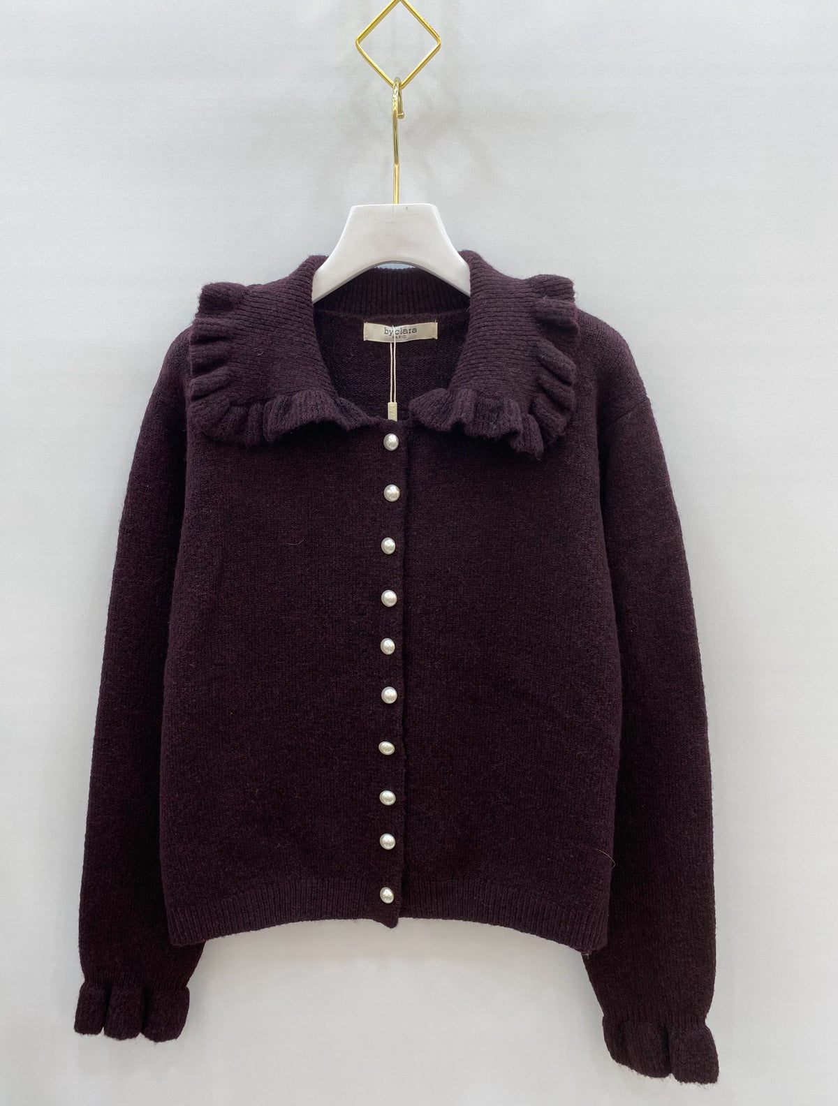 Gilet en maille à col volanté