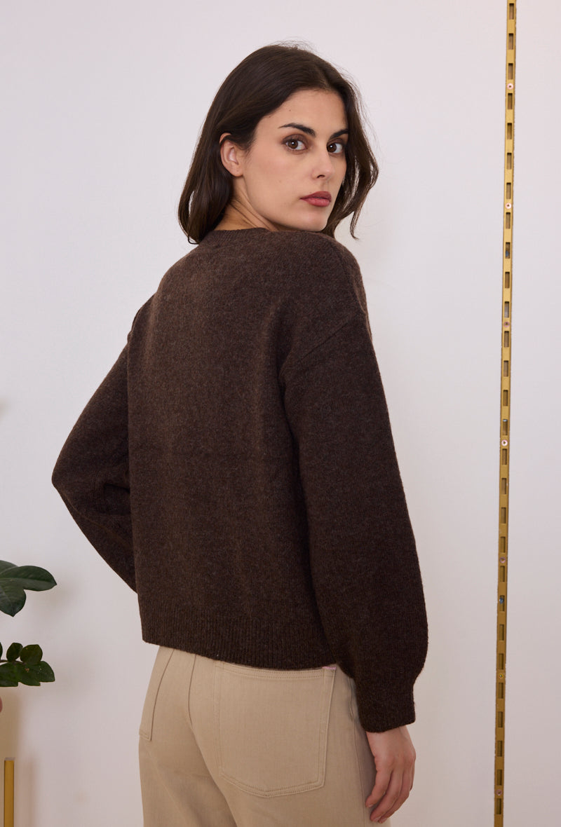 Gilet en maille à boutons dorés