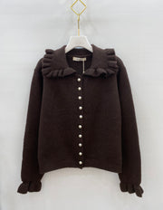 Gilet en maille à col volanté
