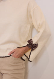 Pull maille nœuds pois
