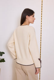 Pull maille nœuds pois