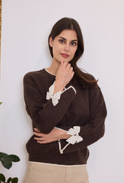 Pull maille nœuds pois