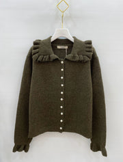 Gilet en maille à col volanté